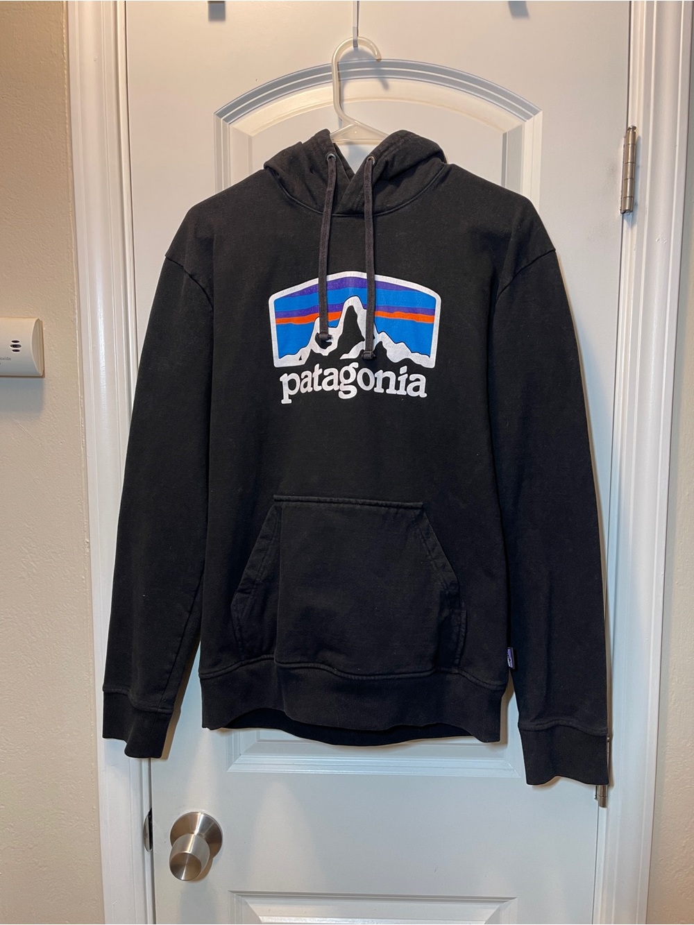 Patagonia Black Hoodie with Blue and Orange Mountain Logo